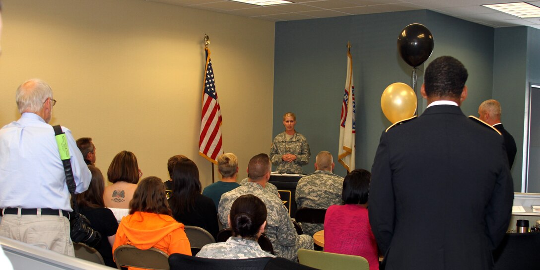 Army Maj. Emily Norton (center) addresses a crowd of Army supporters, future soldiers, and members of the community, during the grand opening of the Army Career Center in Mission Viejo, Calif., June 14.