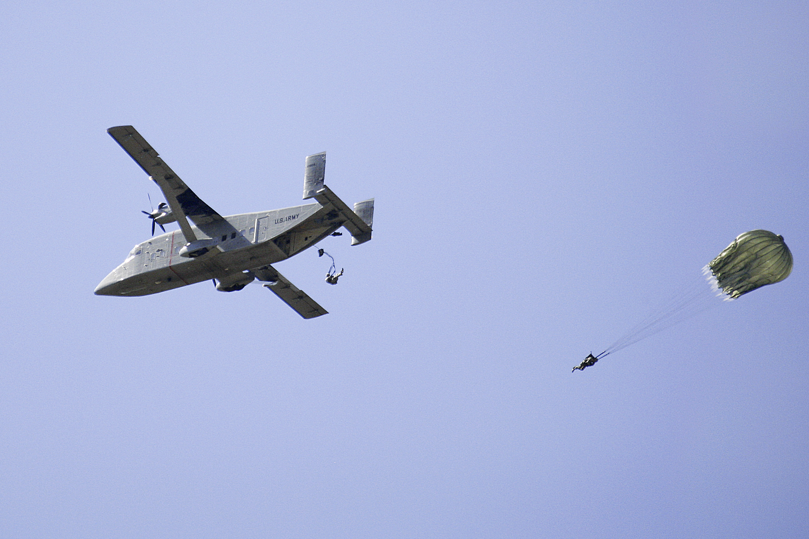 Paratroopers jump out of a C23 Sherpa aircraft over Malamute Drop Zone