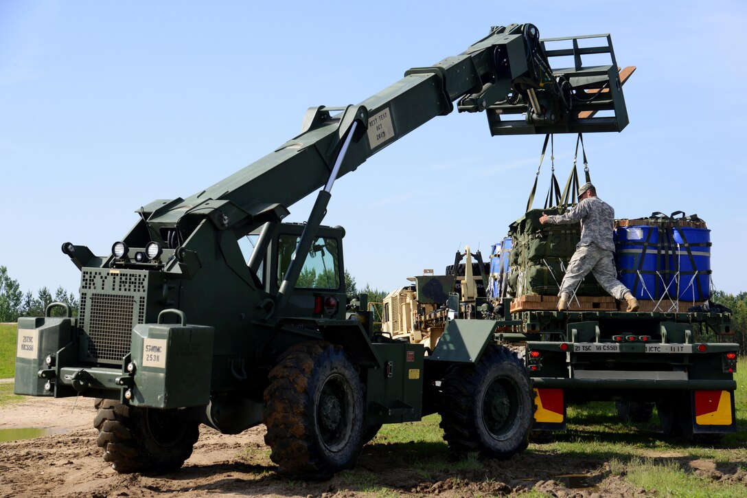 U.S. soldiers use a Skytrak forklift to recover cargo dropped onto the Grafenwoehr Training Area, Germany, June 13, 2013.