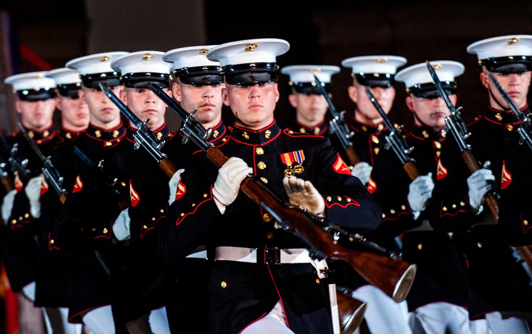 The U.S. Marine Corps Silent Drill Team performs during the evening ...