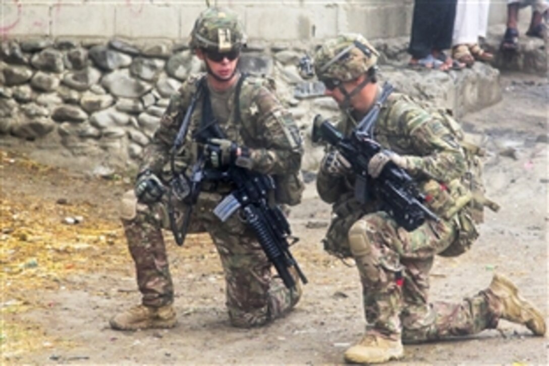 U.S. soldiers provide security during a meeting in Kajir Kheyl village in Afghanistan’s Khowst province, June 12, 2013. The U.S. soldiers have partnered with Afghan national security forces to establish relationships with key village elders and learn about the needs of residents.