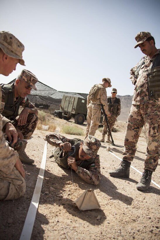 U.S. Marine Corps combat engineers assigned to Battalion Landing Team 3/2, 26th Marine Expeditionary Unit (MEU), conduct counter improvised explosive device training with the Jordanian Armed Forces during Exercise Eager Lion 2013 in Al Quweira, Jordan, June 12, 2013. Exercise Eager Lion 2013 is an annual, multinational exercise designed to strengthen military-to-military relationships and enhance security and stability in the region by responding to modern-day security scenarios. The 26th MEU is a Marine Air-Ground Task Force forward-deployed to the U.S. 5th Fleet area of responsibility aboard the Kearsarge Amphibious Ready Group serving as a sea-based, expeditionary crisis response force capable of conducting amphibious operations across the full range of military operations. (U.S. Marine Corps photo by Staff Sgt. Edward R. Guevara Jr./Released)
