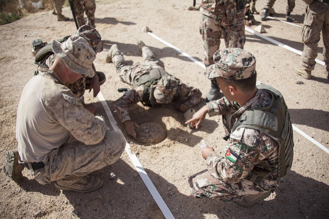 U.S. Marine Corps combat engineers assigned to Battalion Landing Team 3/2, 26th Marine Expeditionary Unit (MEU), conduct counter improvised explosive device training with the Jordanian Armed Forces during Exercise Eager Lion 2013 in Al Quweira, Jordan, June 12, 2013. Exercise Eager Lion 2013 is an annual, multinational exercise designed to strengthen military-to-military relationships and enhance security and stability in the region by responding to modern-day security scenarios. The 26th MEU is a Marine Air-Ground Task Force forward-deployed to the U.S. 5th Fleet area of responsibility aboard the Kearsarge Amphibious Ready Group serving as a sea-based, expeditionary crisis response force capable of conducting amphibious operations across the full range of military operations. (U.S. Marine Corps photo by Staff Sgt. Edward R. Guevara Jr./Released)