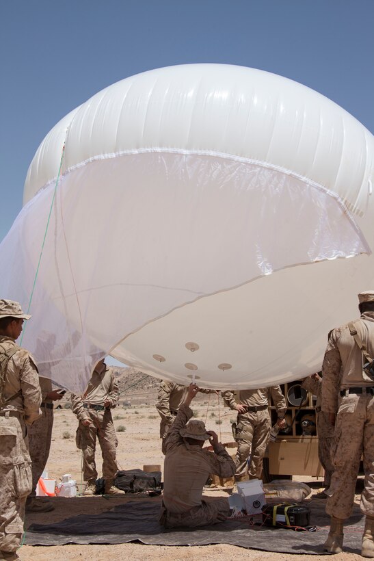 U.S. Marine Corps communications Marines assigned to 26th Marine Expeditionary Unit (MEU) test launch a tethered communications system during Exercise Eager Lion 2013 in Al Quweira, Jordan, June 12, 2013. Exercise Eager Lion 2013 is an annual, multinational exercise designed to strengthen military-to-military relationships and enhance security and stability in the region by responding to modern-day security scenarios. The 26th MEU is a Marine Air-Ground Task Force forward-deployed to the U.S. 5th Fleet area of responsibility aboard the Kearsarge Amphibious Ready Group serving as a sea-based, expeditionary crisis response force capable of conducting amphibious operations across the full range of military operations. (U.S. Marine Corps photo by Staff Sgt. Edward R. Guevara Jr./Released)