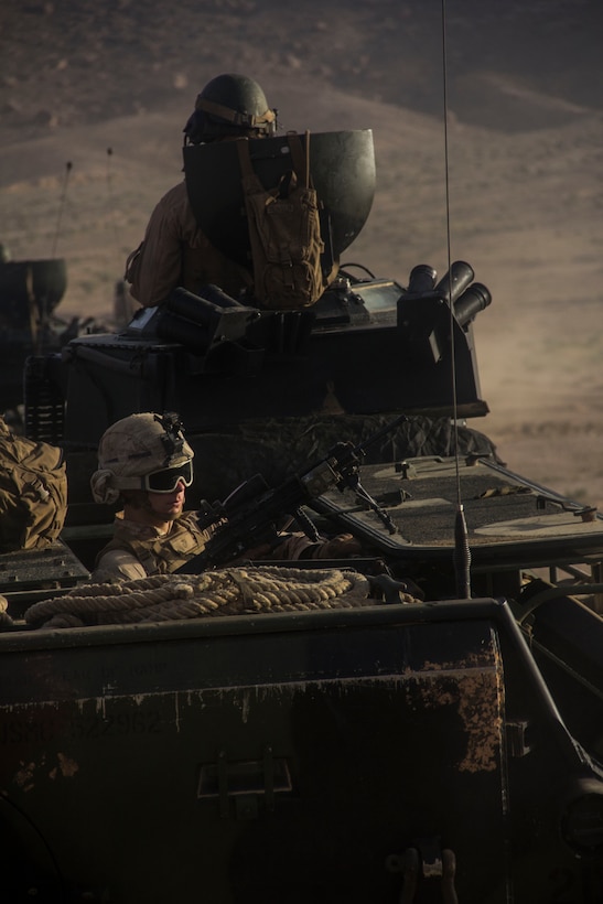 U.S. Marines of Amphibious Assault Vehicle (AAV) Platoon and Company K, Battalion Landing Team 3/2, 26th Marine Expeditionary Unit (MEU), head to a live-fire range in AAVs during Exercise Eager Lion 2013 in Al Quweira, Jordan, June10, 2013. Exercise Eager Lion 2013 is an annual, multinational exercise designed to strengthen military-to-military relationships and enhance security and stability in the region by responding to realistic, modern-day security scenarios. The 26th MEU is a Marine Air-Ground Task Force forward-deployed to the U.S. 5th Fleet area of responsibility aboard the Kearsarge Amphibious Ready Group serving as a sea-based, expeditionary crisis response force capable of conducting amphibious operations across the full range of military operations. (U.S. Marine Corps photo by Cpl. Michael S. Lockett/Released)