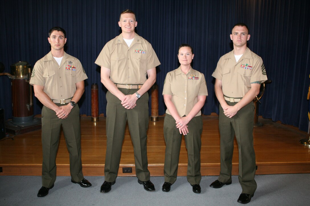 Four Marines from Marine Corps Security Cooperation Group (MCSCG) graduated from an initial language acquisition course at the Defense Language Institute (DLI) Foreign Language Center (FLC), Virginia Beach Training Detachment, June 7.From left to right: Staff Sgt. Timothy Lynch, Capt. Bryant Kruse, Gunnery Sgt. Crystal Hannan and Gunnery Sgt. Kevin Kearns.