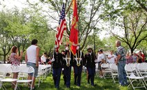 Members of the 9th Marine Corps District color guard carry the American flag and Marine Corps organizational colors during a flag retirement ceremony in honor of National Flag Day, June 14. The event was held at the Missouri Korean War Veterans Memorial.
