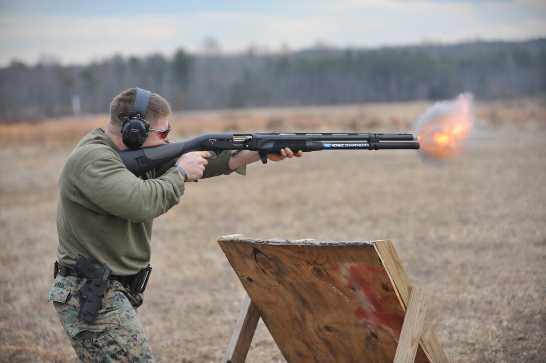 Sgt. Brandan Jansen, team captain, Combat Shooting Team, fires a shotgun during Long Range Training on Range 14D on Feb. 5, 2013. 