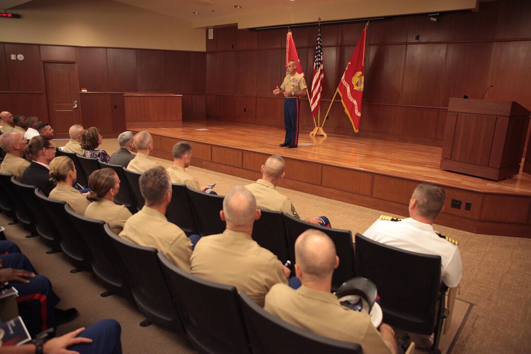 Sgt. Maj. James E. Booker, former Marine Forces Reserve and Marine Forces North sergeant major, addresses an audience of family, friends, peers and young Marines, after relinquishing his post during his relief and farewell ceremony at the Marine Corps Support Facility New Orleans, MARFORRES headquarters, June 14. Booker will be taking the position of North Atlantic Treaty Organization, International Security Assistance Force and United States Forces-Afghanistan senior enlisted advisor for Gen. Joseph F. Dunford, commander of the NATO ISAF and USFORAF. (Official U.S. Marine Corps photo by Cpl. Fenton Reese)