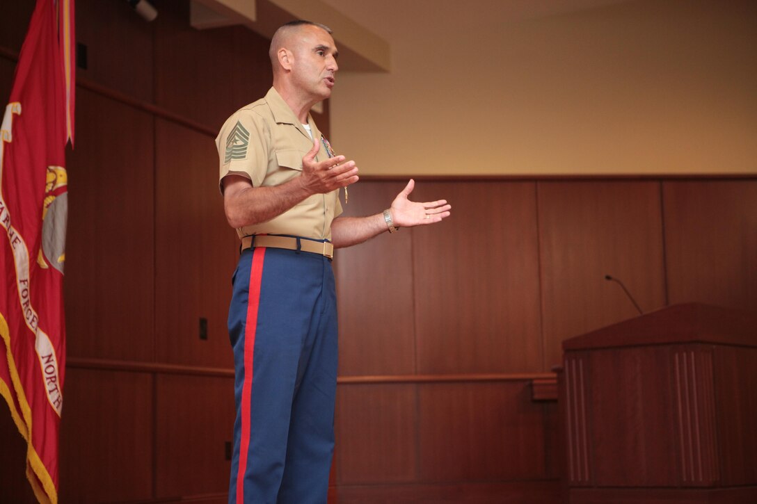 Sgt. Maj. James E. Booker, former Marine Forces Reserve and Marine Forces North sergeant major, addresses an audience of family, friends, peers and young Marines, after relinquishing his post during his relief and farewell ceremony at the Marine Corps Support Facility New Orleans, MARFORRES headquarters, June 14. Booker will be taking the position of North Atlantic Treaty Organization, International Security Assistance Force and United States Forces-Afghanistan senior enlisted advisor for Gen. Joseph F. Dunford, commander of the NATO ISAF and USFORAF. (Official U.S. Marine Corps photo by Cpl. Fenton Reese)