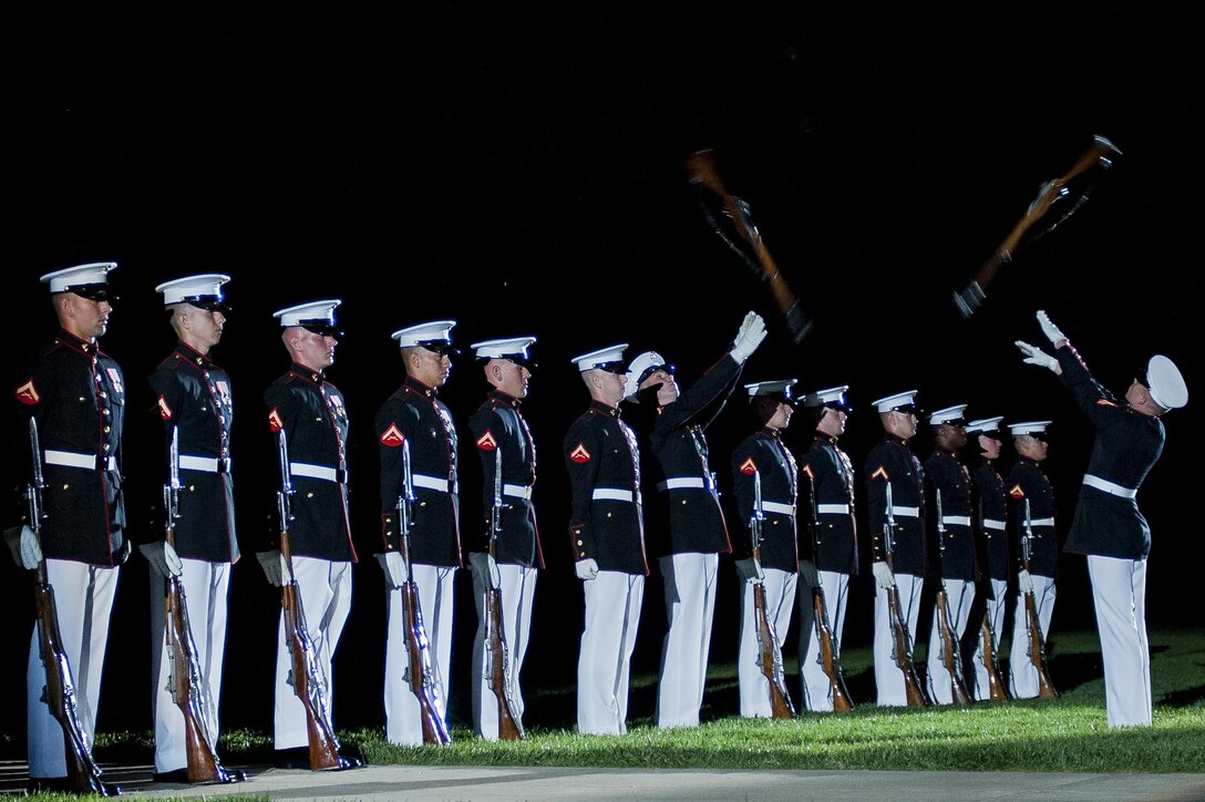 The Marine Corps Silent Drill Platoon performs during a Friday Evening Parade at Marine Barracks Washington, D.C., June 14. (Official Marine Corps photo by Lance Cpl. Dan Hosack/Released)