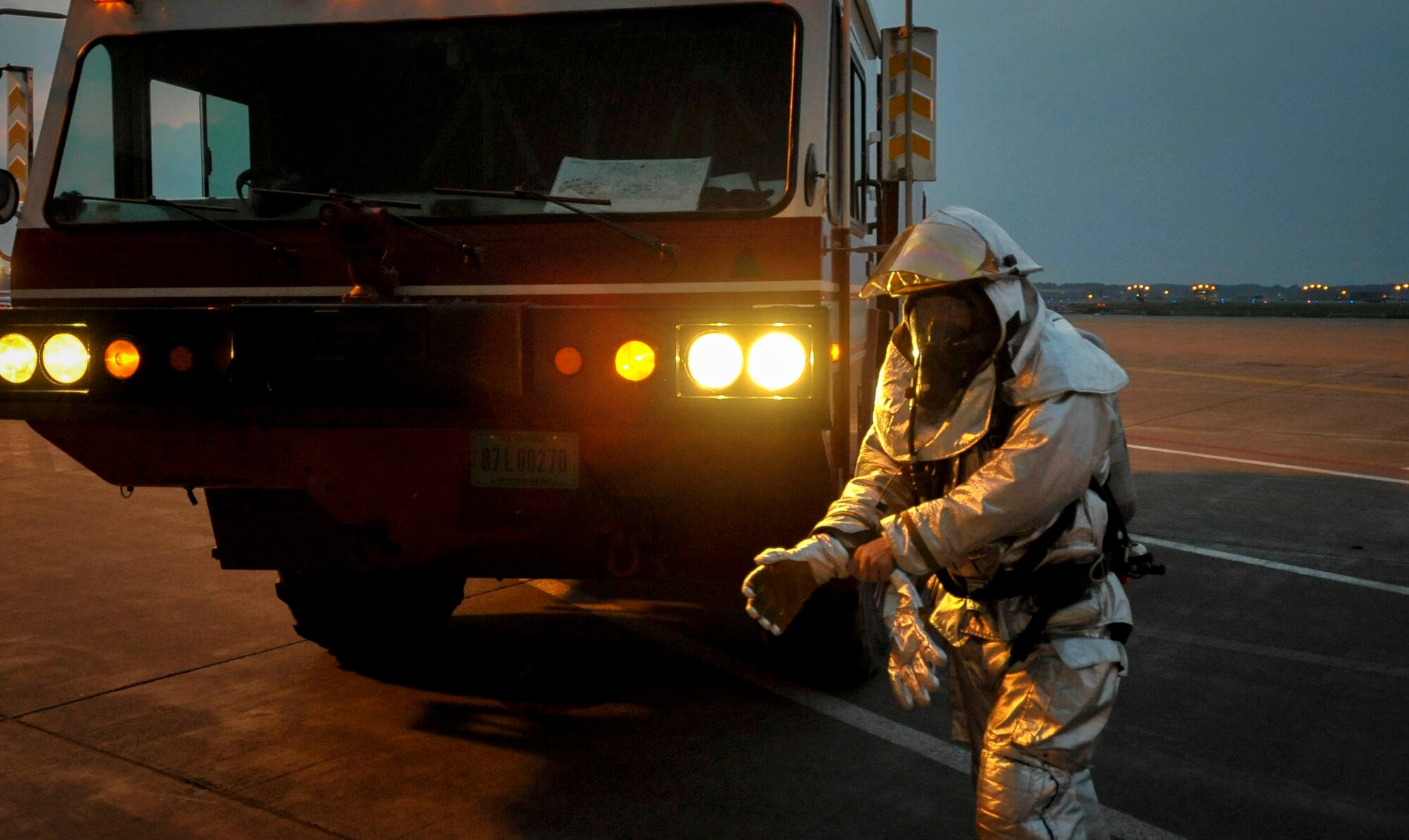 A firefighter from the 35th Civil Engineer Squadron responds to a simulated fire as part of an Operational Readiness Exercise at Misawa Air Base, Japan, June 18, 2013. The training allows firefighters to sharpen their skills in a non-combat environment. (U.S. Air Force photo by Staff Sgt. Nathan Lipscomb)