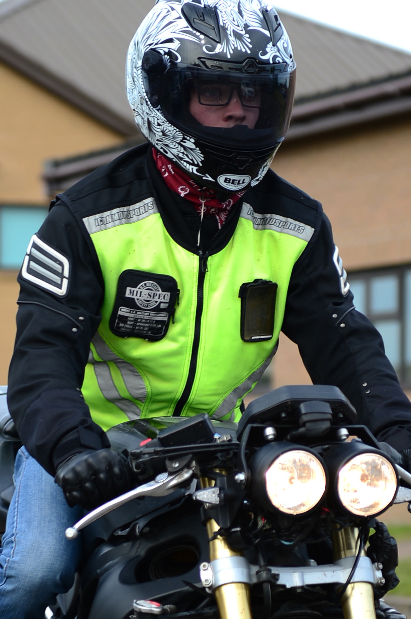 ROYAL AIR FORCE LAKENHEATH - Senior Airman Nikolas Kinder, 48th Equipment Maintenance Squadron phase inspection journeyman, rides his motorcycle June 17, 2013. Airmen who ride motorcycles are required to wear an approved helmet; a long-sleeved shirt or jacket that is brightly colored, visible and reflective at night; long pants; full-fingered gloves; sturdy footwear and eye protection including prescription glasses. For members in England, helmets must meet United Nations Economic Commission for Europe Standard 22.05 or British Standard 6658 and be properly fastened under the chin. (U.S. Air Force photo by Senior Airman Lausanne Morgan)