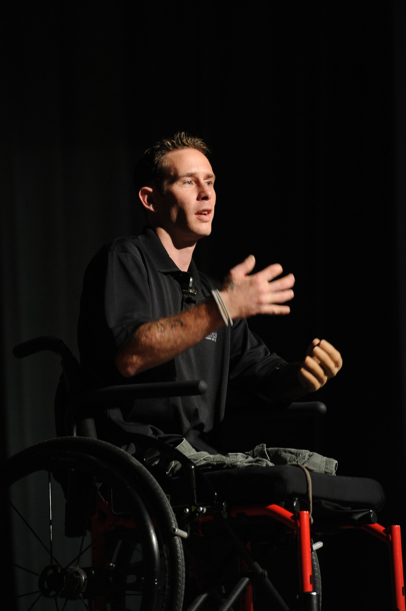 Bryan Anderson, U.S. Army veteran and triple amputee, gave words of wisdom and perseverance to service members at the Keystone Theater on Kadena Air Base, Japan, June 18, 2013. After telling his story of how he lost his limbs and some of the things he has experienced since his injury, he allowed audience members to ask him various questions about his life and how he has stayed positive. (U.S. Air Force photo by Airman 1st class Malia Jenkins/Released)
