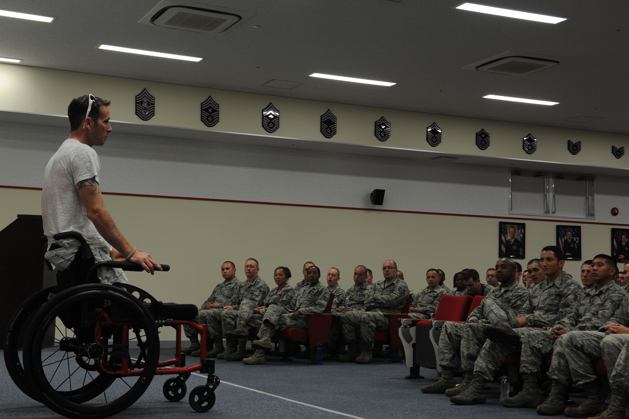 Bryan Anderson, U.S. Army veteran and triple amputee, talks to new NCOs and senior NCOs at the Erwin Professional Military Education Center on Kadena Air Base, Japan, June 14, 2013. Students had the opportunity to ask Anderson a variety of questions regarding how he dealt with his injury and tips about fighting through depression. (U.S. Air Force photo by Airman 1st Class Malia Jenkins/Released)  
