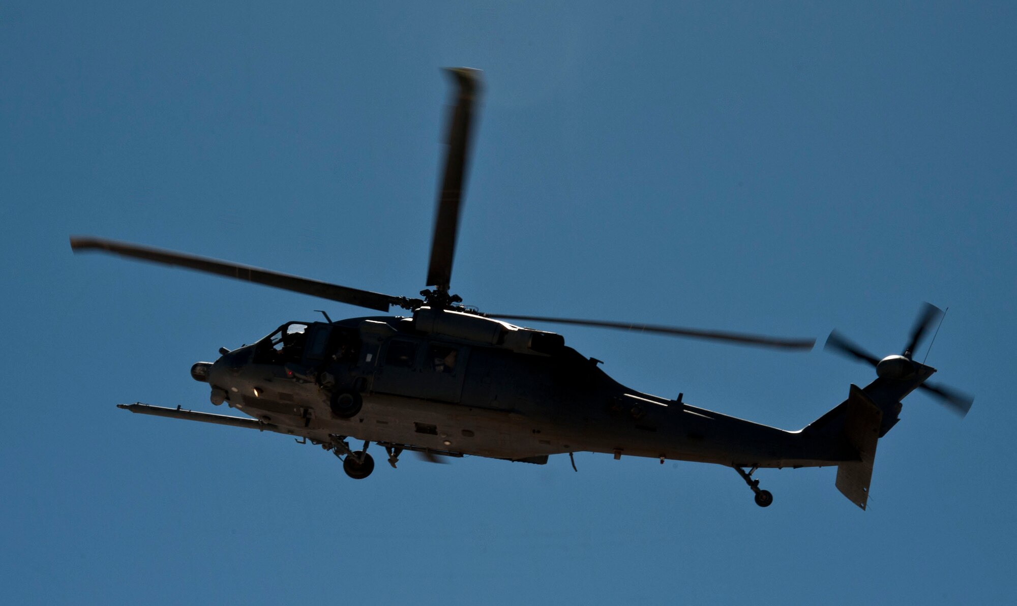 An HH-60G Pave Hawk assigned to the 66th Rescue Squadron, prepares to land after conducting a search and rescue mission in California June 14, 2013, at Nellis Air Force Base, Nev. The 66th RQS conducted a successful real-world mission, finding and rescuing a lost hiker in the Mammoth Lakes area in California. (U.S. Air Force photo by Senior Airman Daniel Hughes)