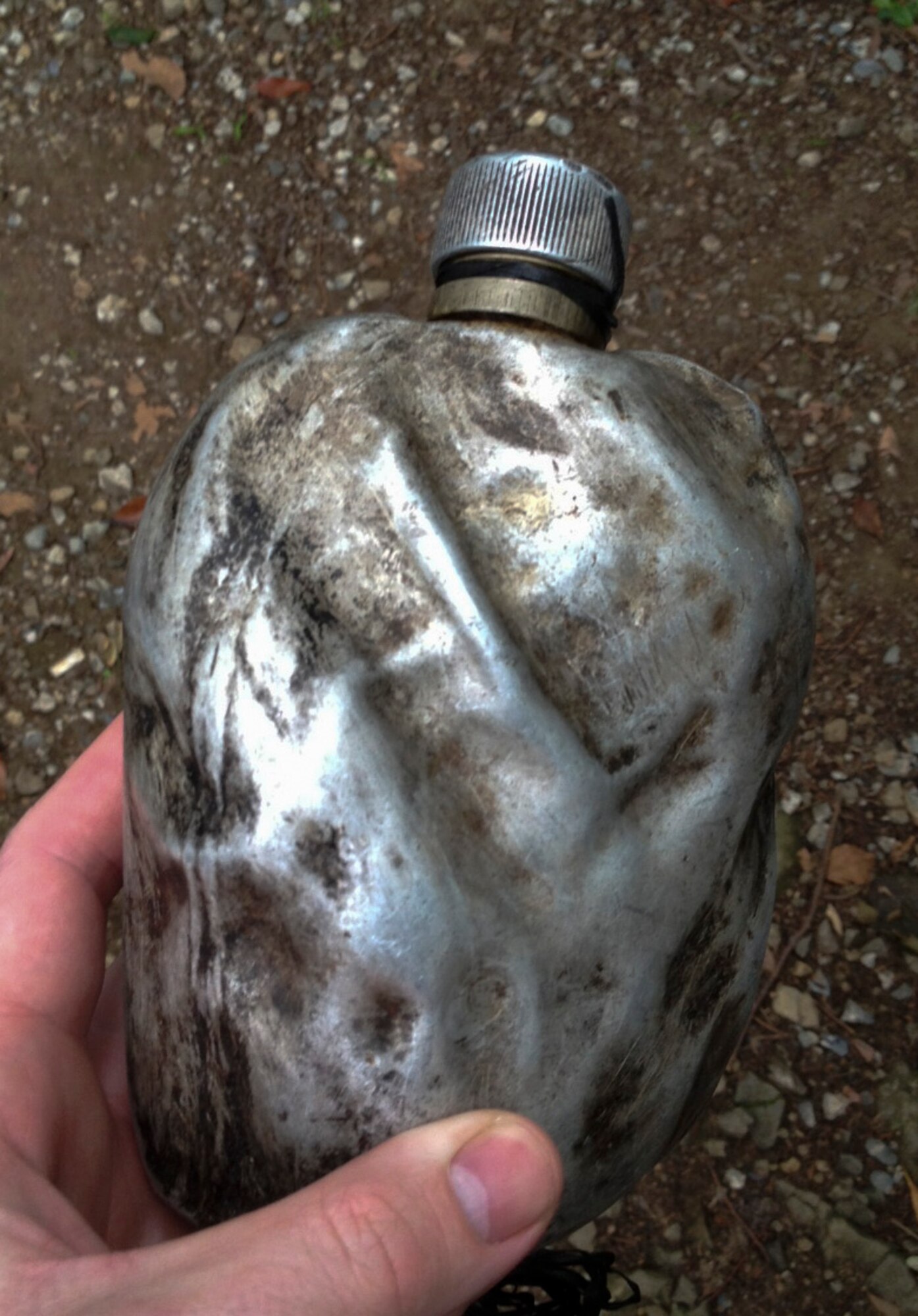 130615-F-DS848-002 – A blackened canteen with the recessed hand print of a fallen Airman is used to pour whiskey over the marble monument at the B-29 ceremony at Shizuoka, Japan, June 15, 2013. This annual tradition honors the Airmen who lost their lives on June 20, 2013. (U.S. Air Force photo by Tech. Sgt. Davy Huffman)
