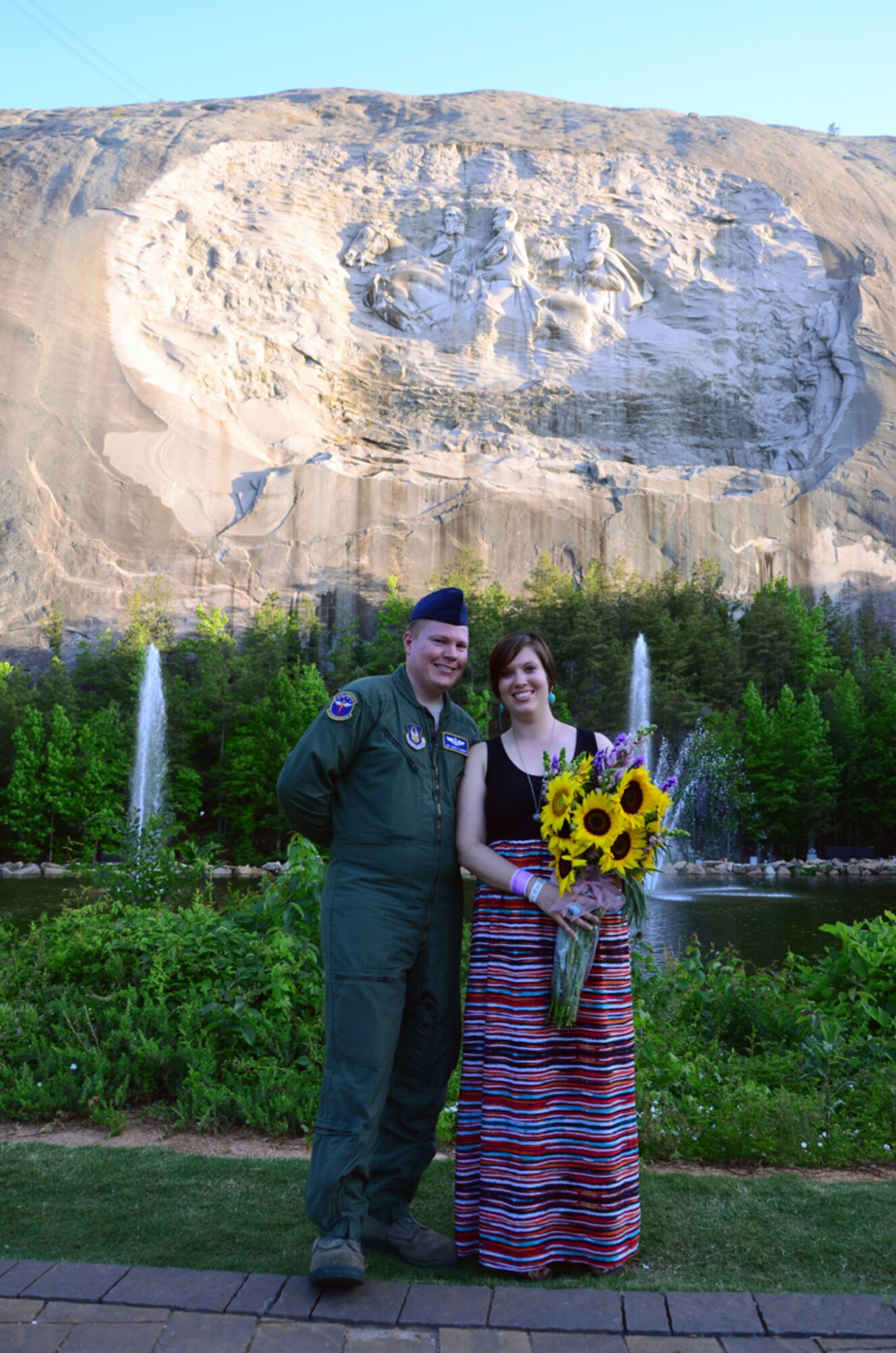 Back off ladies! Tech. Sgt. Joshua Albertin, 94th Aeromedical Evacuation Squadron medical technician, presents his girlfriend Diana Stephens Montana sapphire ring as he proposed to her during a Salute to the Military concert at Stone Mountain Park, May 25. “My dad was a fighter pilot, so I’m not stranger to the military way of life,” said Stephens. “I’m prepared to support him in any way, just as I know he will support me.” (U.S. Air Force photo/Senior Airman Elizabeth Van Patten)