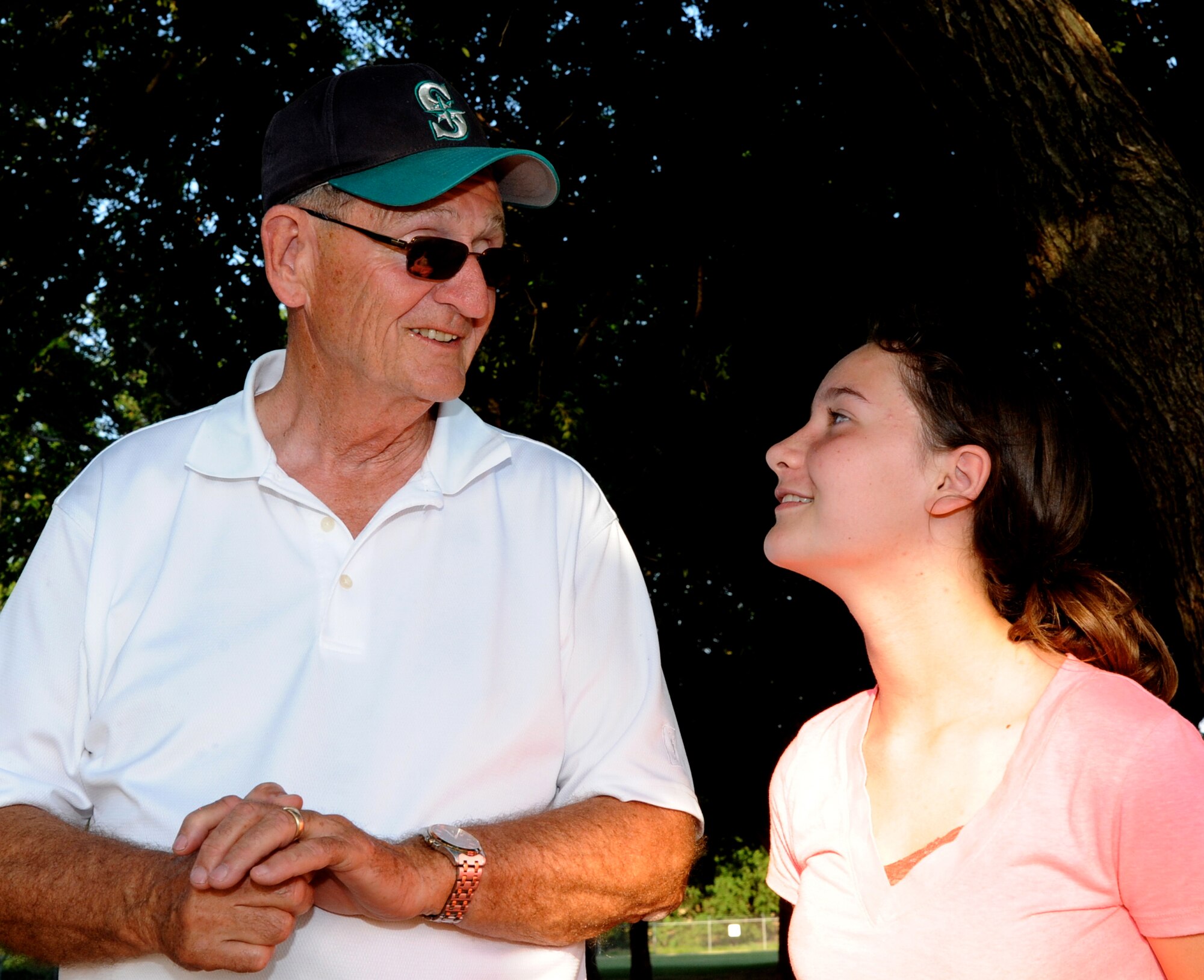 Enid Mayor Bill Shewey, left, discusses the fine art of making s’mores with Sarina Wilcox, one of 27 campers attending Camp Tomahawk, a free two-week summer camp for local children ages 9-11, held June 3-14, at Vance Air Force Base, Okla. (U.S. Air Force photo/ Senior Airman Frank Casciotta)