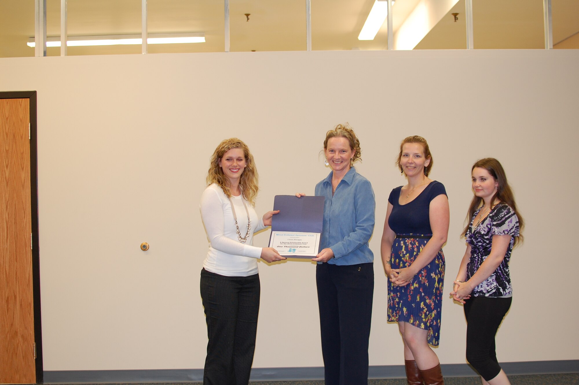 MINOT AIR FORCE BASE, N.D. -- With financial support from Northrop Grumman Corp., the Minot Enlisted Spouses' Club, recently awarded two enlisted spousal scholarships for the 2013-14 School Year. Recipients: Lauren Misciagna and Carly Neale Each, each were awarded in the amount of $1000. Lauren Misciagna will continue her pursuit of an Associate's Degree in Nursing at Williston State College this Fall, and Carly Neale, currently enrolled in Elementary Education at Minot State University, will continue her academic studies there this Fall. The MESC wishes to extend its congratulations to both enlisted spouses on earning these awards. (Courtesy photo)