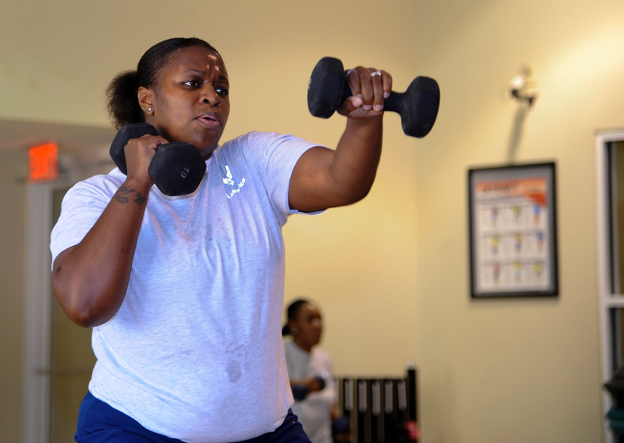 Staff Sgt. Marcia Deloach, 1st Special Operations Aerospace Medicine Squadron public health technician worksout during a Post Pregnancy physical training session at the Riptide Fitness Center on Hurlburt Field, Fla., June 17, 2013. Each session consists of full body movements, pushups, squats and sprints. (U.S. Air Force photo by Airman 1st Class Jeffrey Parkinson)