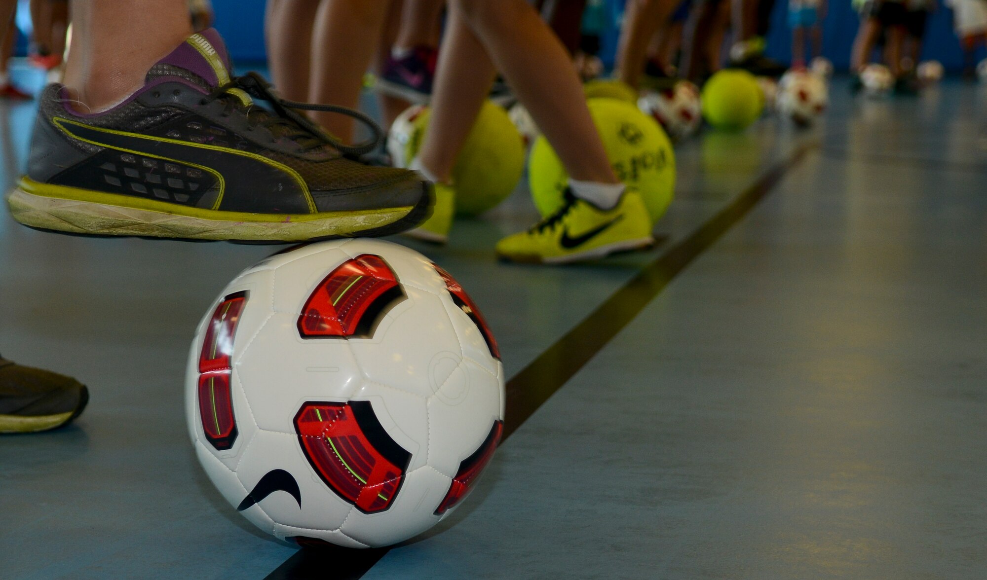Children practice ball control during an exercise directed by Mia Hamm, former Olympian, June 15, 2013, at Fort Eustis, Va. Participants also practiced juggling and hand-eye coordination techniques. (U.S. Air Force photo by Airman 1st Class Austin Harvill/Released)