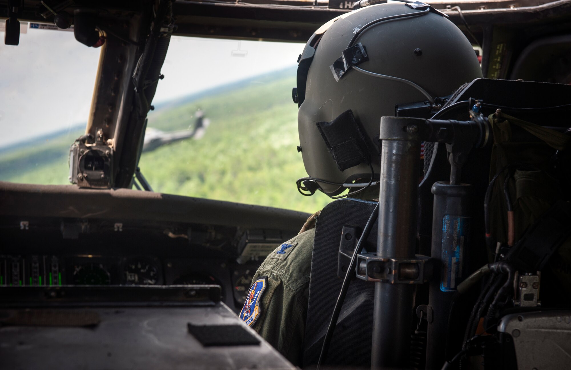 U.S. Air Force Col. Billy D. Thompson, 23d Wing commander, pilots an HH-60G Pave Hawk during his final flight at Moody Air Force Base, Ga., June 14, 2013. The final or “fini” flight is a long-standing Air Force tradition that traces its roots back to the Vietnam War when pilots would commemorate their final combat mission. (U.S. Air Force photo by Senior Airman Jarrod Grammel/Released)
