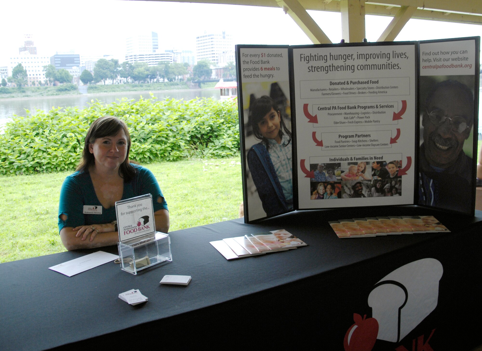 Ruthanne Herzing, special events and promotions coordinator for the Central Pennsylvania Food Bank, mans a display at the 2013 5K for Food, organized and hosted by volunteers from the 193rd Special Operations Wing. (U.S. Air National Guard photo by Staff Sgt. Susan Penning/Released