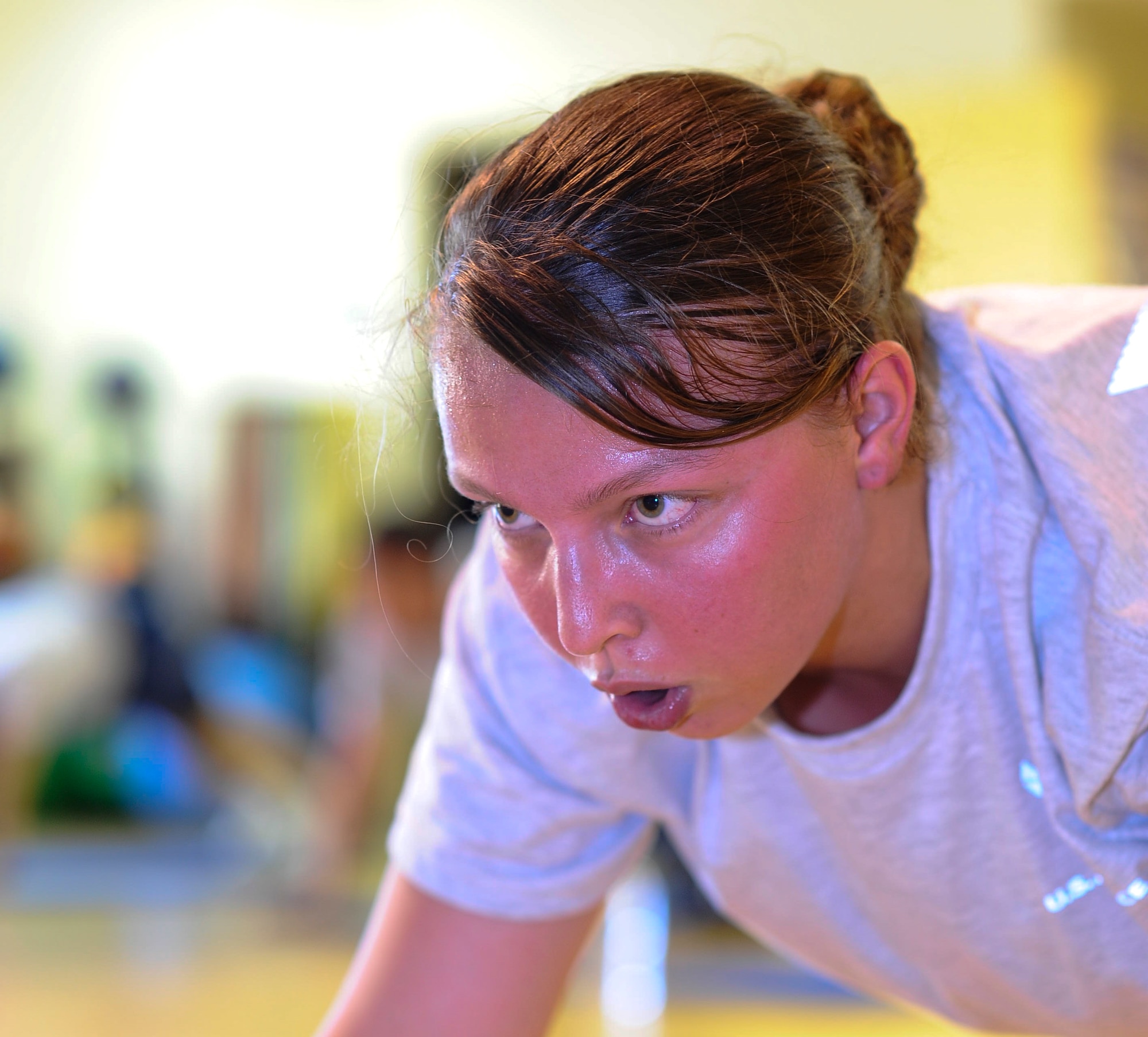 Staff Sgt. Kristina Plunkett, 1st Special Operations Dental Squadron dental assistant, holds a plank during a Post Pregnancy physical training session at the Riptide Fitness Center on Hurlburt Field Fla., June 17, 2013. The Hurlburt Field Health and Wellness Center has offered the program since January 2012. (U.S. Air Force photo by Airman 1st Class Jeffrey Parkinson)