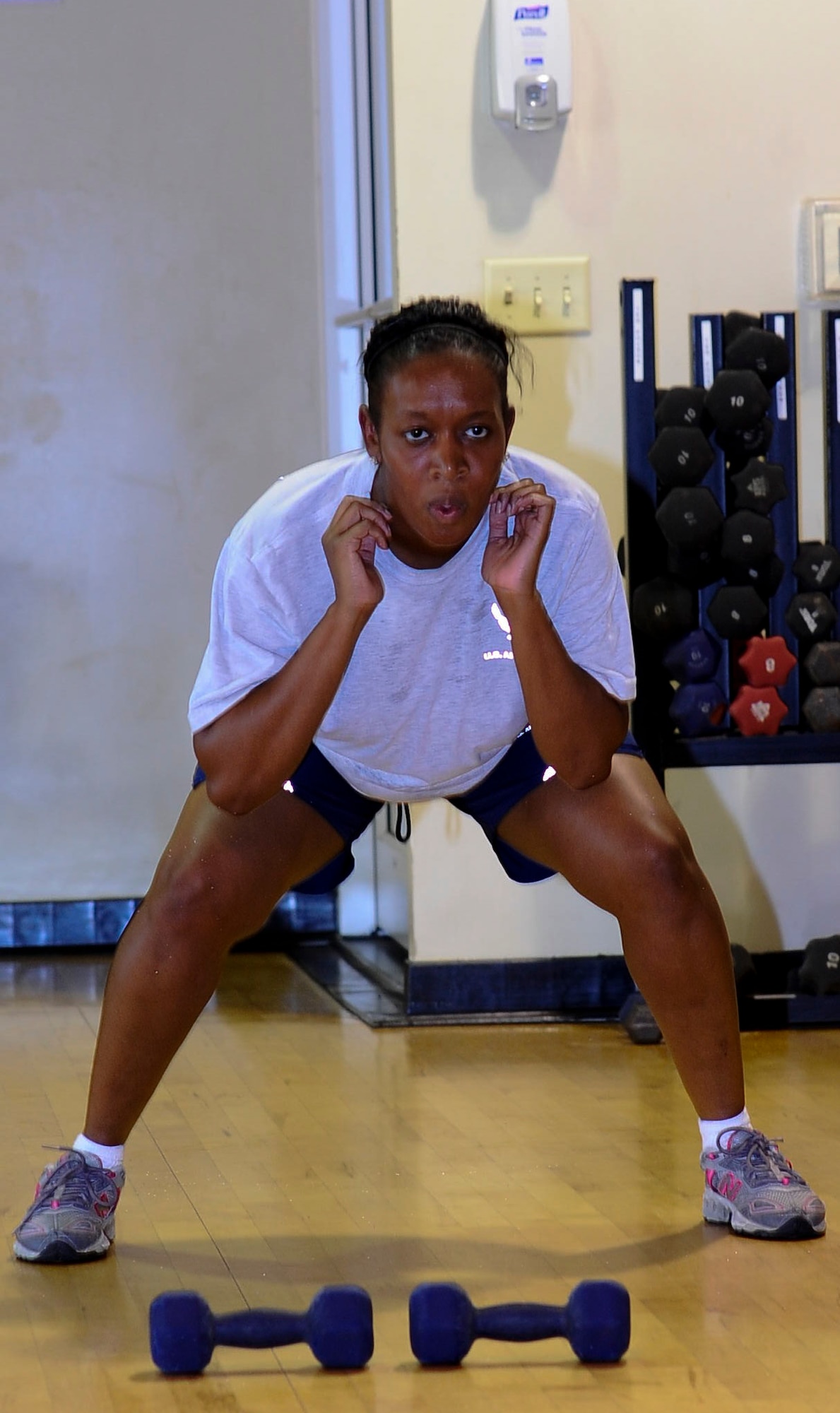 Master Sgt. Tomekia King, 1st Special Operations Dental Squadron NCO in-charge, performs squats during Post Pregnancy physical training at the Riptide Fitness Center on Hurlburt Field, Fla., June 17, 2013. “I was worried about my [physical fitness] before learning about the program,” King said, “I definitely see improvements in my [physical fitness] as far as cardio and strength. I think Post Pregnancy PT should be a mandatory program.” (U.S. Air Force photo by Airman 1st Class Jeffrey Parkinson)

