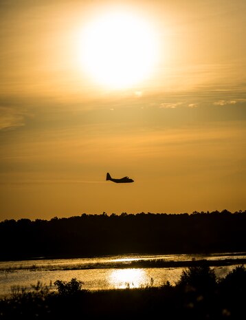 An Air Force Reserve aircrew flying a C-130 Hercules assigned to the 910th Airlift Wing, Youngstown Air Reserve Station, Ohio, performs aerial spraying of mosquitos June 15, 2013, over Joint Base Charleston – Weapons Station, S.C. The insecticide the unit uses is mixed with water to dilute the product. (U.S. Air Force photo/Senior Airman Dennis Sloan)