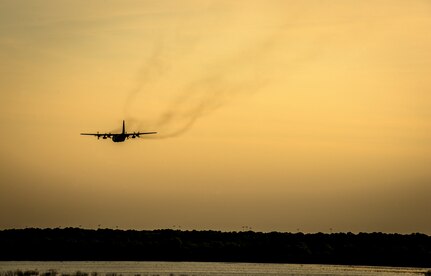 An Air Force Reserve aircrew flying a C-130 Hercules assigned to the 910th Airlift Wing, Youngstown Air Reserve Station, Ohio, performs aerial spraying of mosquitos June 15, 2013, over Joint Base Charleston – Weapons Station, S.C. The insecticide the unit uses is mixed with water to dilute the product. (U.S. Air Force photo/Senior Airman Dennis Sloan)