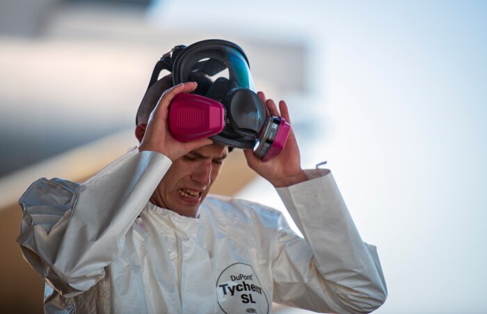 Senior Airman Thaddeus Root, 910th Airlift Wing spray maintainer, Youngstown Air Reserve Station, Ohio, removes his protective mask after handling the spray used to eliminate mosquitos June 15, 2013, at Joint Base Charleston – Air Base, S.C. The spray crew is the only one of its kind in the Air Force, assisting multiple bases year-round with their specific area of expertise. Spraying for mosquitos was conducted over the JB Charleston – Weapons Station.  (U.S. Air Force photo/Senior Airman Dennis Sloan)