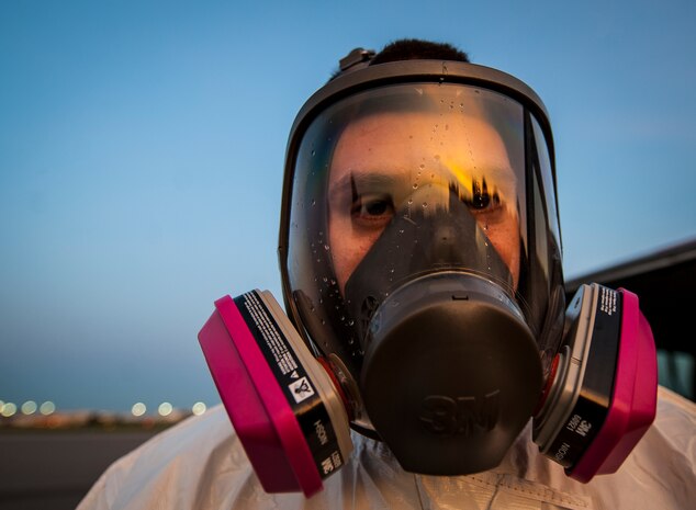 Senior Airman Thaddeus Root, 910th Airlift Wing spray maintainer, Youngstown Air Reserve Station, Ohio, wears a protective mask when handling the spray product used to eliminate mosquitos June 15, 2013, at Joint Base Charleston – Air Base, S.C. The spray crew is the only one of its kind in the Air Force, assisting multiple bases year-round with their specific area of expertise. Spraying for mosquitos was conducted over the JB Charleston – Weapons Station.  (U.S. Air Force photo/Senior Airman Dennis Sloan)