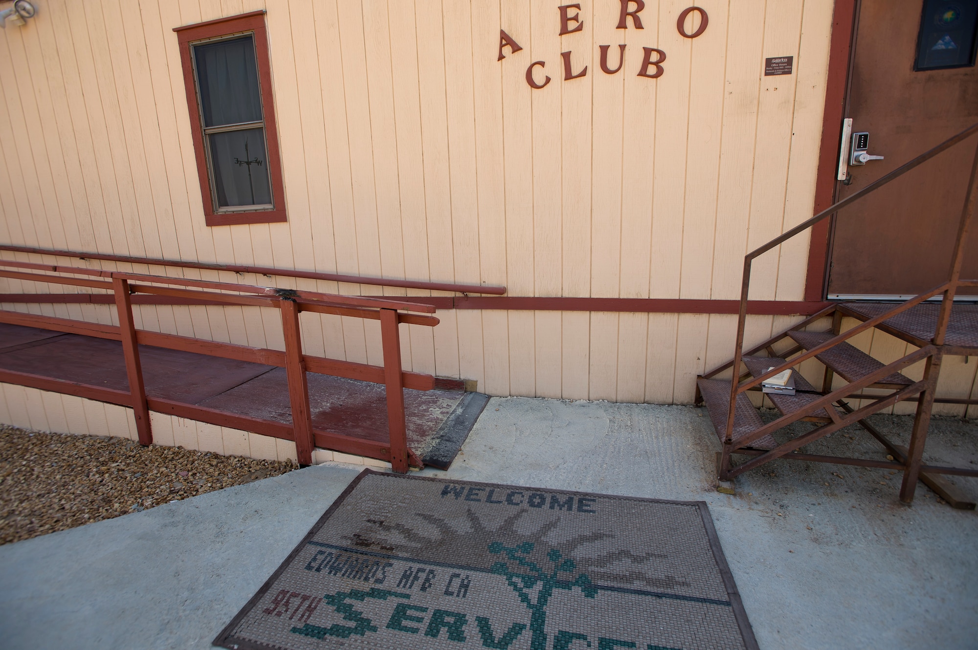 A small fire was extinguished on a hand rail at the Aero Club June 17. The cause of the fire is believed to be that of a smoldering cigarette. (U.S. Air Force photo by Ethan Wagner)