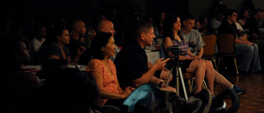 Parents watch children perform the story of "Snow White" on Barksdale Air Force Base, La., June 14, 2013. For more than 40 years, the Missoula Children's Theatre has cast children as cast members and used the performing arts to teach them life skills. (U.S. Air Force photo/Airman 1st Class Andrew Moua)