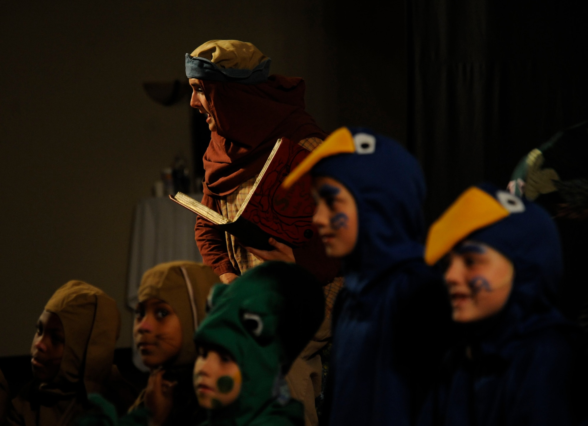 Witless the Woodsman, portrayed by Shelby Art, Tour Director of the Missoula Children's Theatre, tells the tale of "Snow White" on Barksdale Air Force Base, La., June 14, 2013. This year the theatre will work with 65,000 children in more than 1,200 communities in all 50 states and 17 countries. (U.S. Air Force photo/Airman 1st Class Andrew Moua)