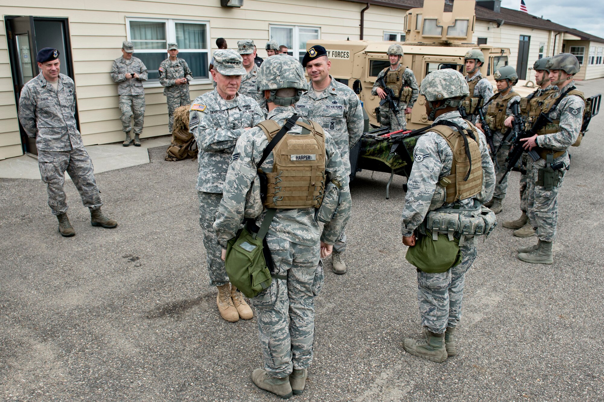 Gen. Martin E. Dempsey, chairman of the Joint Chiefs of Staff, talks with Air Force Security Forces at Minot AFB, ND, Jun 17, 2013.  Dempsey visited Minot to observe the Air Force Nuclear Triad operations and visit with the Airmen.  DOD Photo by D. Myles Cullen