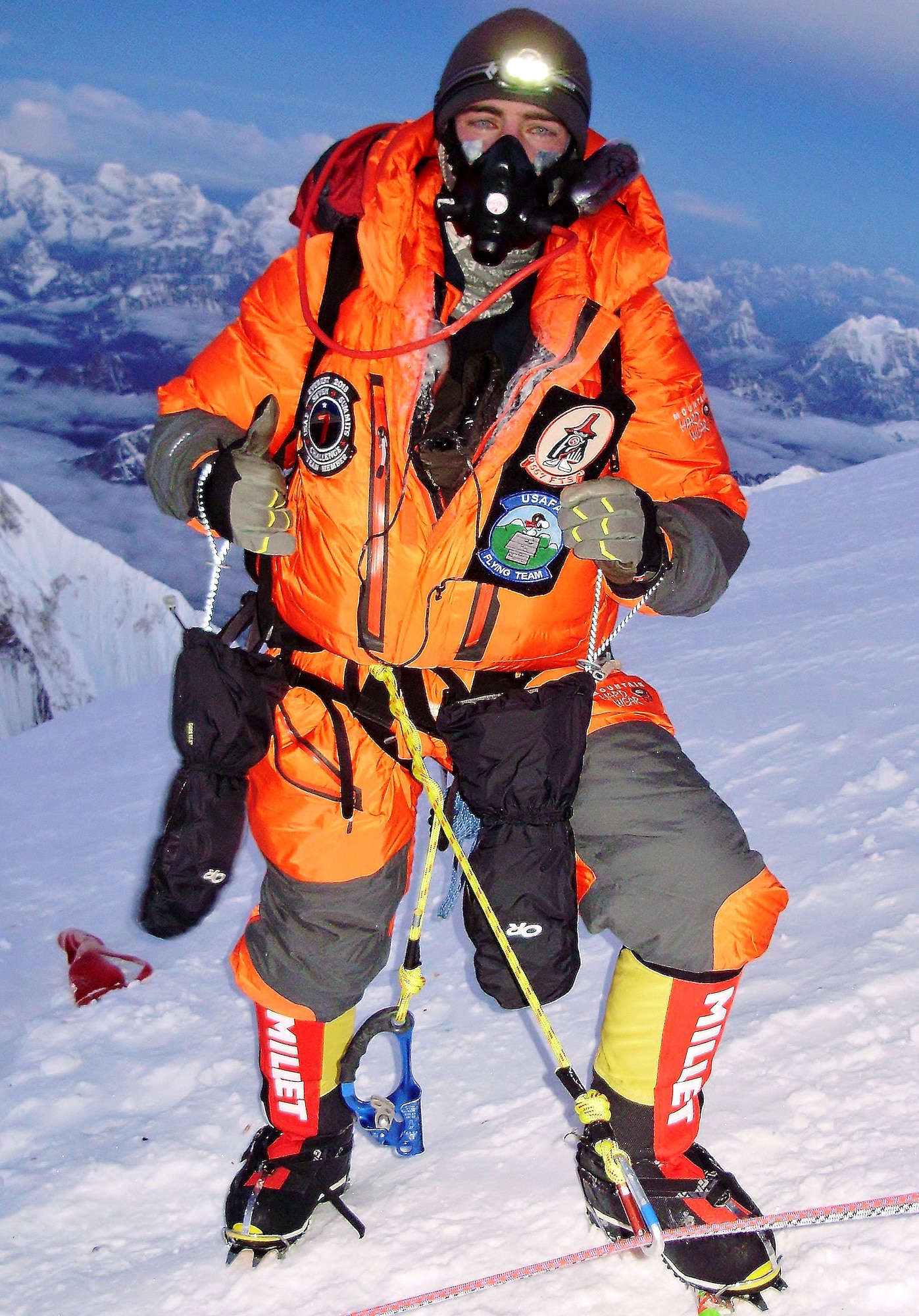 Capt. Marshall Klitzke gives a thumbs up at the top of Mount Everest, Nepal, in May 2013. Everest is the tallest mountain on Earth, standing 29,029 feet above sea level. Klitzke is an instructor pilot with the 557th Flying Training Squadron at the Air Force Academy in Colorado Springs, Colo., and an Academy graduate. (U.S. Air Force photo)