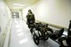 Airmen from the 35th Medical Group rush a simulated casualty down hospital halls during the second phase of an Operational Readiness Exercise at Misawa Air Base, Japan, June 17, 2013. The ORE tests Airmen on proper wartime techniques.  (U.S. Air Force photo by Airman 1st Class Kaleb Snay)