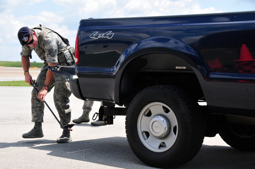 Staff Sgt. Heath Williams checks the undercarriage of a truck during an exercise at McGhee Tyson Air National Guard Base, TN.  Staff Sgt Williams is a member of the 134 ARW Security Forces Squadron. (National Guard photo by Master Sgt. Kendra M. Owenby, 134 ARW Public Affairs/Released by Capt Joseph Keith, 134 ARW Public Affairs Officer) 