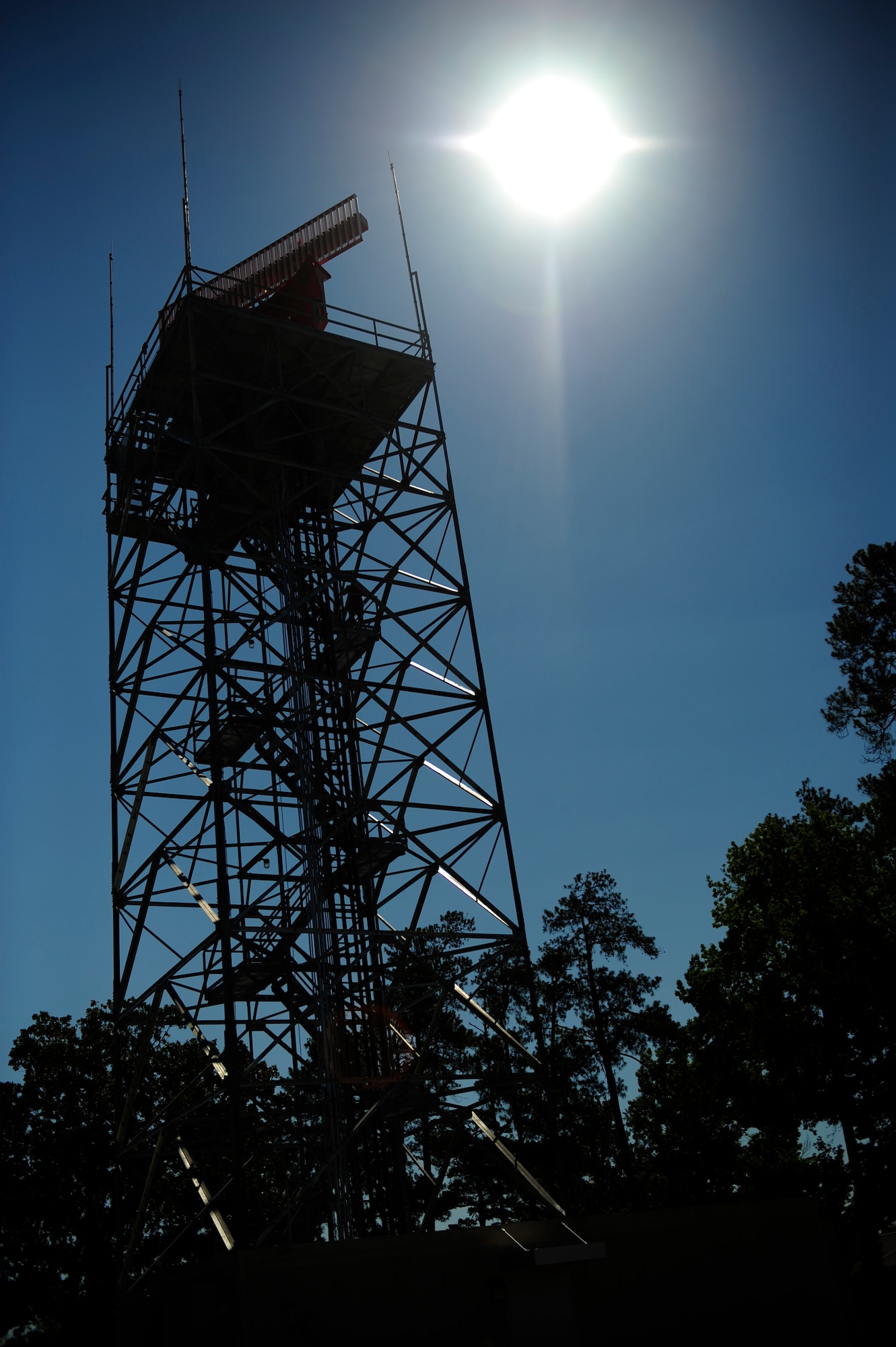 Staff Sgt. Nathan Coley, 20th Communications Squadron ground radar systems supervisor, ascends the Digital Airport Surveillance Radar tower to perform regular system checks and maintenance at Shaw Air Force Base, S.C., June 14, 2013. Coley helps maintain and repair radar surveillance equipment at Shaw so those on the ground can have eyes in the sky. (U.S. Air Force photo by Airman 1st Class Daniel Blackwell/Released)