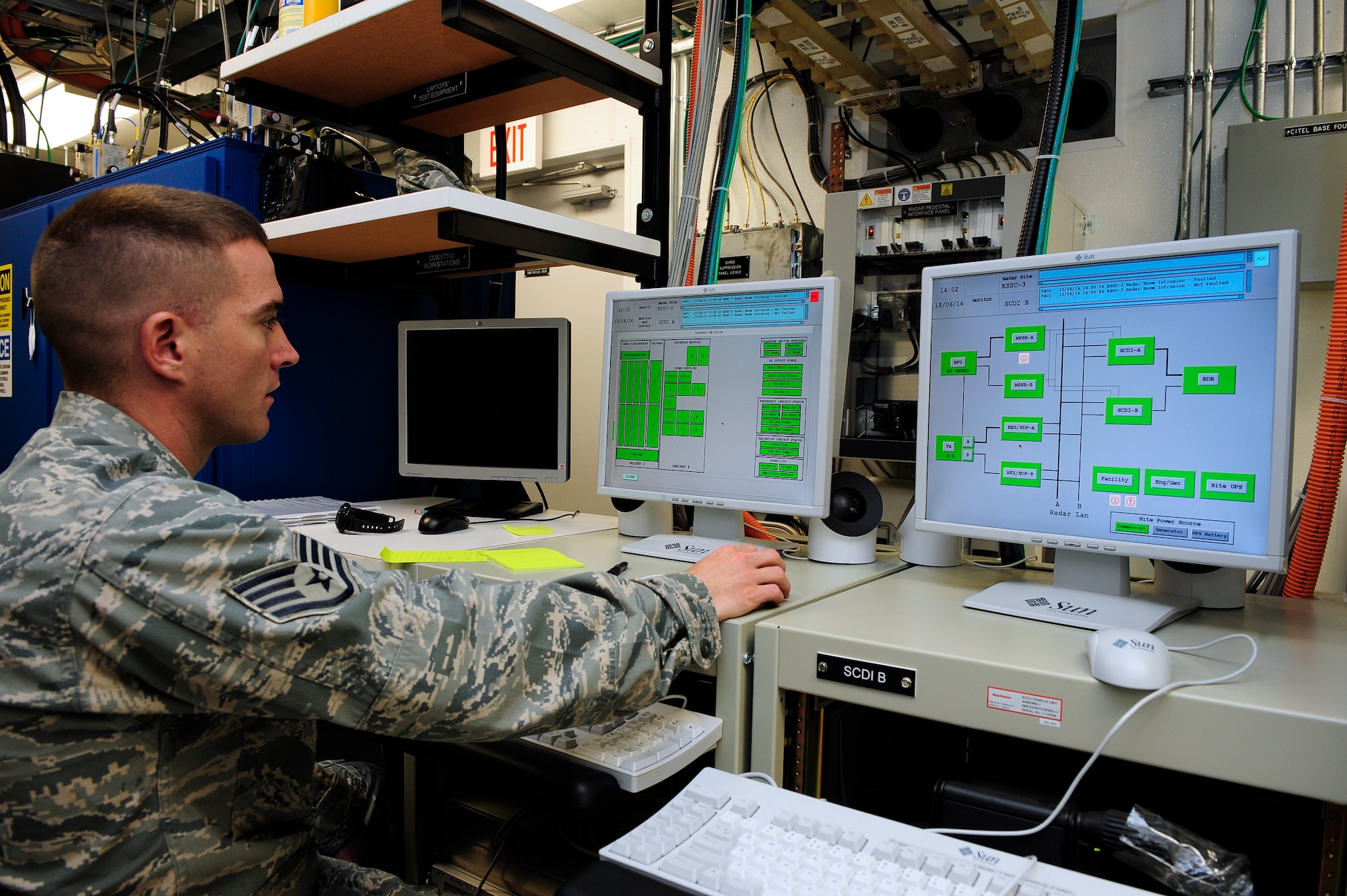 Staff Sgt. Nathan Coley, 20th Communications Squadron ground radar systems supervisor, sits at the site control and data interface system to check the sub-system statuses and overall performance of the Digital Airport Surveillance Radar at Shaw Air Force Base, S.C., June 14, 2013. Coley helps maintain and repair radar surveillance equipment at Shaw so those on the ground can have eyes in the sky. (U.S. Air Force photo by Airman 1st Class Daniel Blackwell/Released)