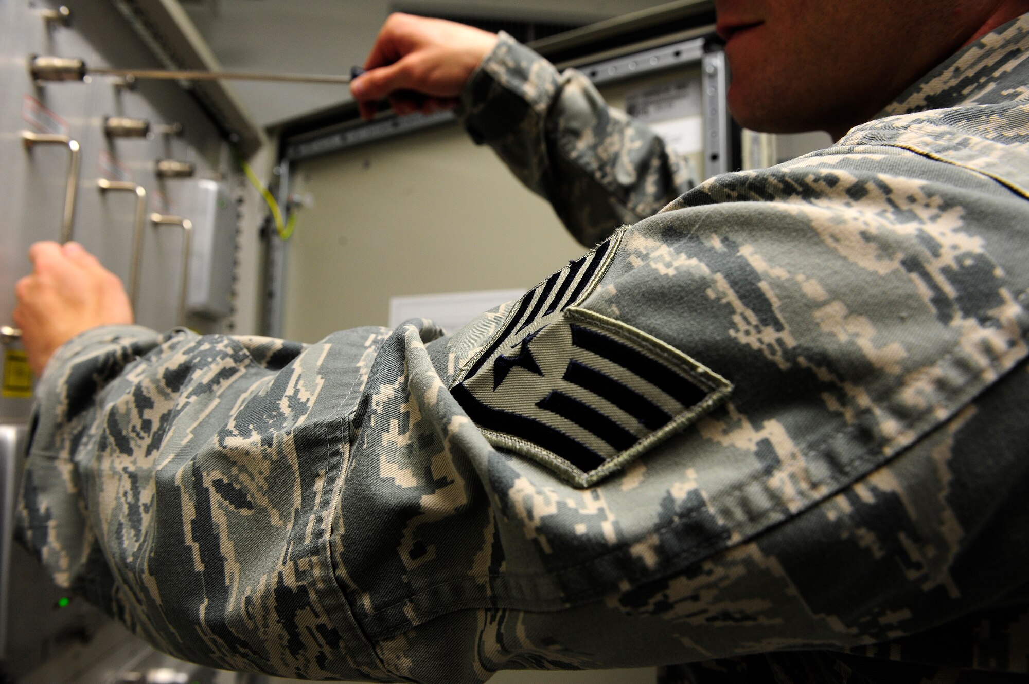 Staff Sgt. Nathan Coley, 20th Communications Squadron ground radar systems supervisor, demonstrates the necessary steps to replace one of the eight transmitter amplifiers for the Digital Airport Surveillance Radar’s Primary Surveillance Radar at Shaw Air Force Base, S.C., June 14, 2013. Coley helps maintain and repair radar surveillance equipment at Shaw so those on the ground can have eyes in the sky. (U.S. Air Force photo by Airman 1st Class Daniel Blackwell/Released)