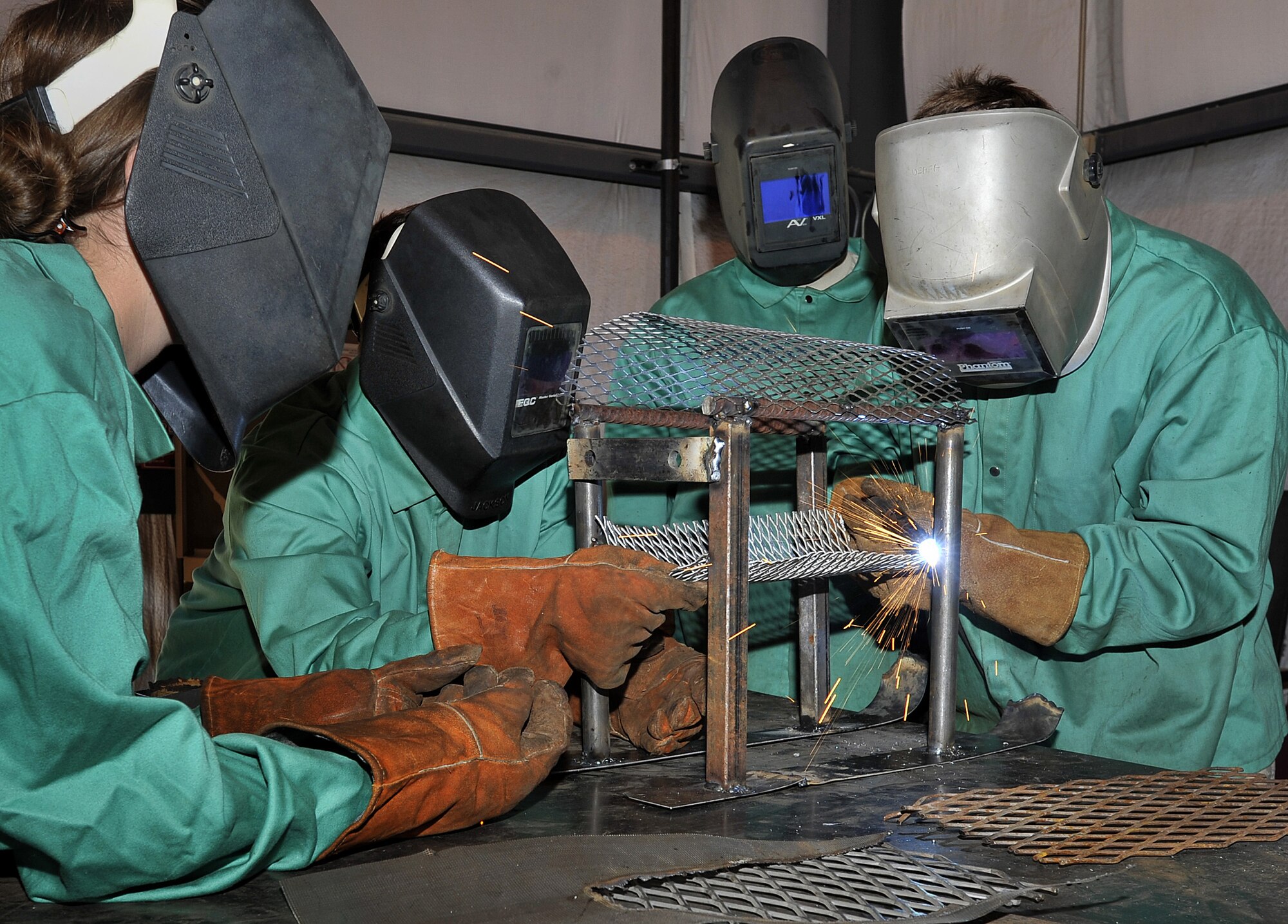 Cadets in the Air Force Academy's Field Engineering Readiness Laboratory practice their welding skills June 5, 2013. The three-week lab allows cadets to apply lessons from the previous semester's engineering classes in an operational environment. (U.S. Air Force photo/Raymond McCoy)
