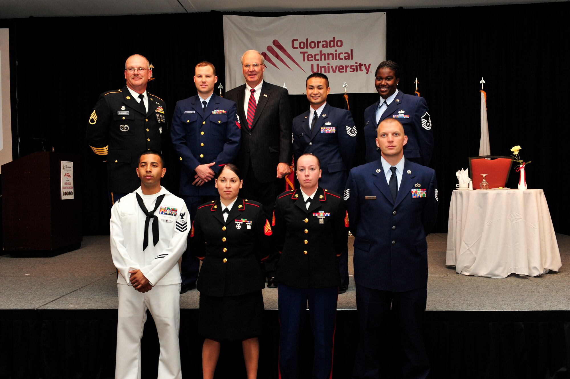 Winners from the 37th Annual Armed Forces Recognition Luncheon gather for a group photo June 14, 2013, at the Renaissance Hotel in Denver. The Aurora Chamber of Commerce and Defense Council recognized 11 military members from all branches and components for their achievements on and off duty. (U.S. Air Force photo by Airman 1st Class Darryl Bolden Jr./Released)