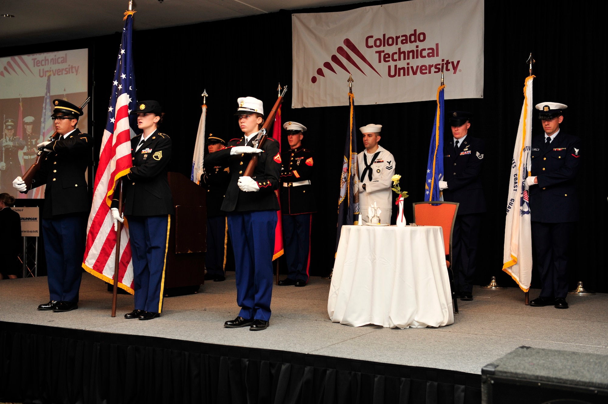 Aerospace Data Facility-Colorado Joint Color Guard from Buckley Air Force Base, Colo., present service flags and the American flag during the 37th Annual Armed Forces Recognition Luncheon June 14, 2013, at the Renaissance Hotel in Denver. The luncheon, hosted by the Aurora Chamber of Commerce and Defense Council, recognized several local service members. (U.S. Air Force photo by Airman 1st Class Darryl Bolden Jr./Released) 