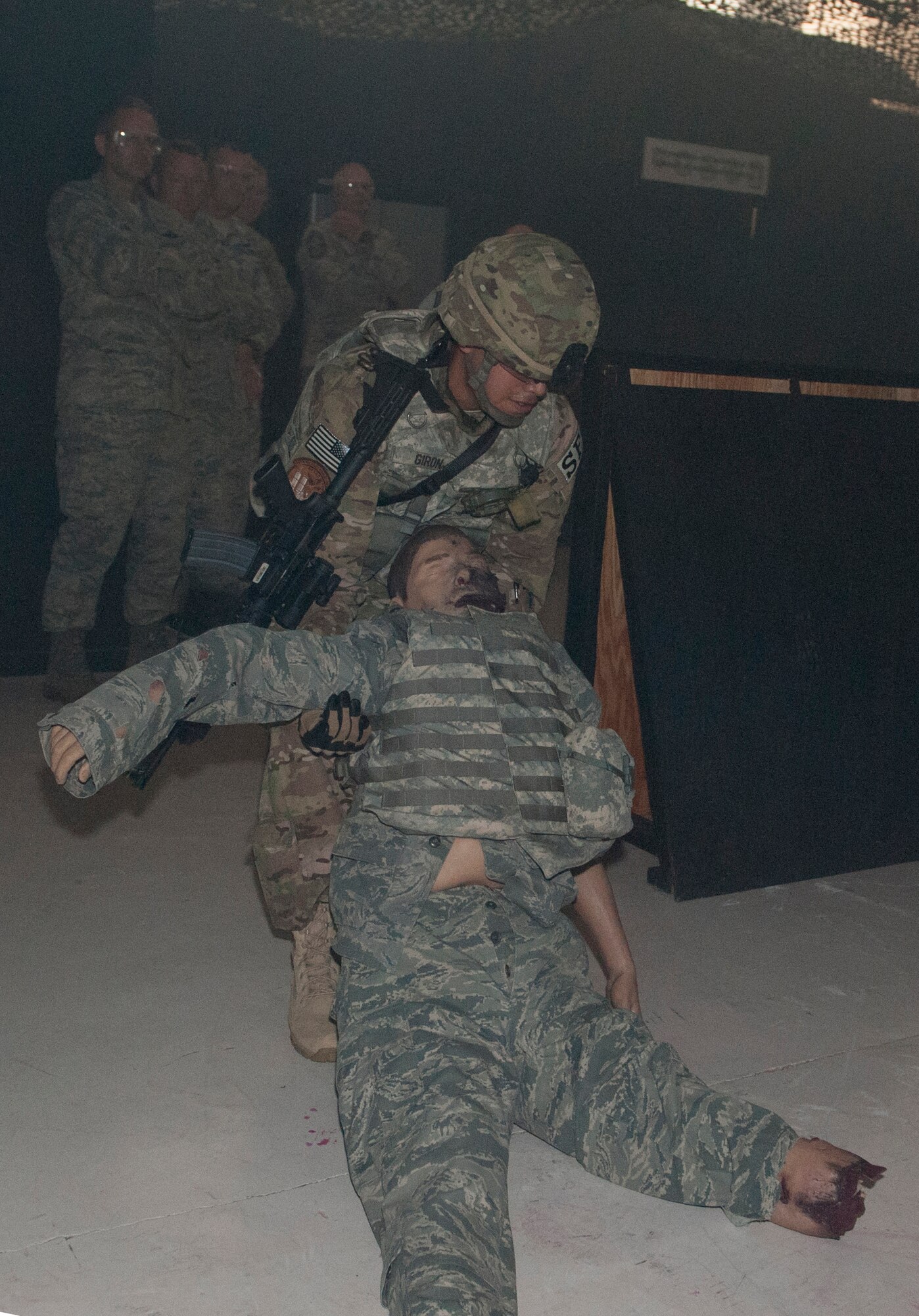 An Airman from the U.S. Air National Guard 105th Security Forces Squadron simulates a medical evacuation for visiting leadership of the 105th SFS headquarters at Moody Air Force Base, Ga., June 12, 2013. The demonstrations are held to inform the unit’s leadership on the latest training and tactical equipment being used in combat. (U.S. Air Force photo by Senior Airman Eileen Meier/Released)