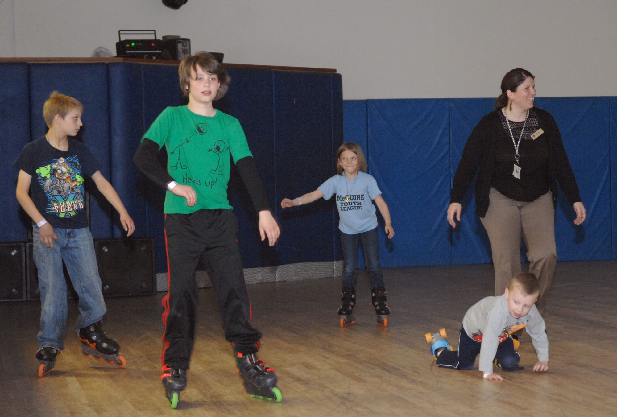 A group of 100th Force Support Squadron Exceptional Family Member Program members practice skating June 17, 2013, during a skate and craft night at the skate rink on RAF Lakenheath, England. The event gave EFMP members a chance to get together and enjoy a night of creativity and fun. (U.S. Air Force photo by Airman 1st Class Dillon Johnston/Released)