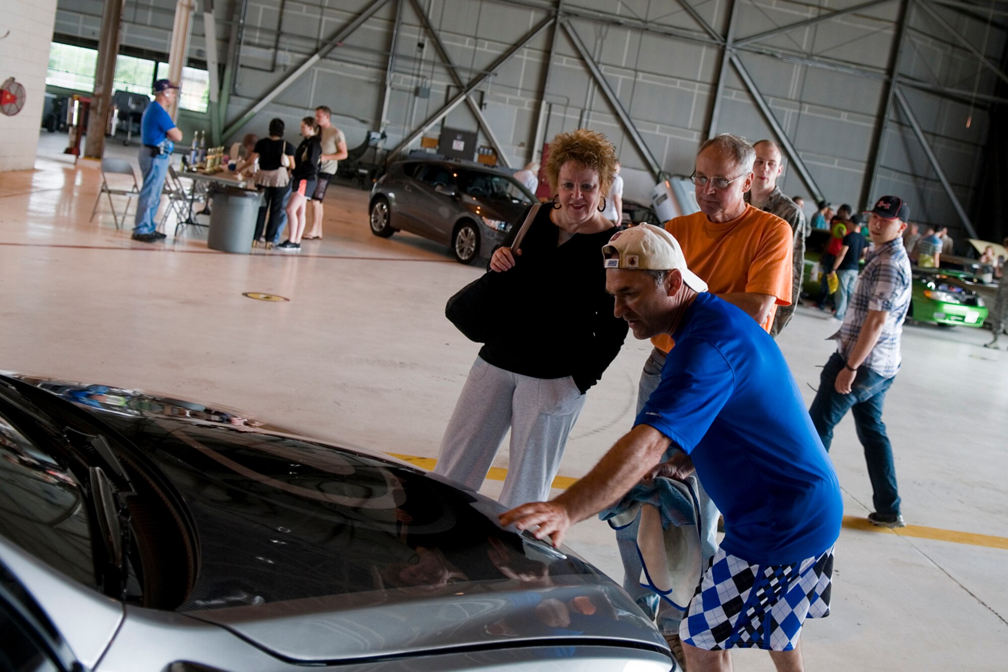 Lt. Col. Greg DeMaio, 434th Air Refueling Wing chief of performance planning, displays his 2003 Lexus IS 300 at a car show held during Grissom's Family Appreciation Day here June 1, 2013. The day was filled with a host of activities meant to give Grissom families a close look at the 434th ARW mission. (U.S. Air Force photo/Senior Airman Jami K. Lancette)